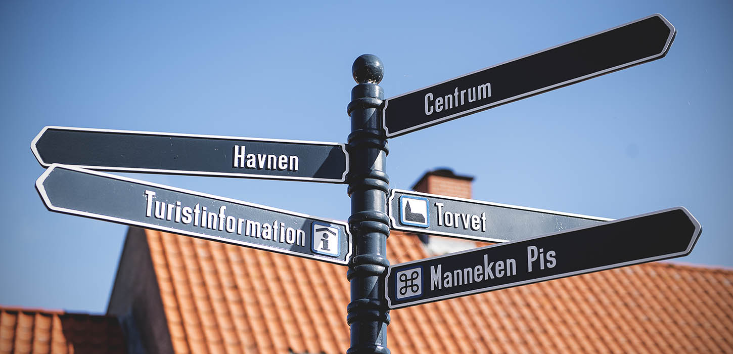 Signs in the street show the way to Bogense's attractions