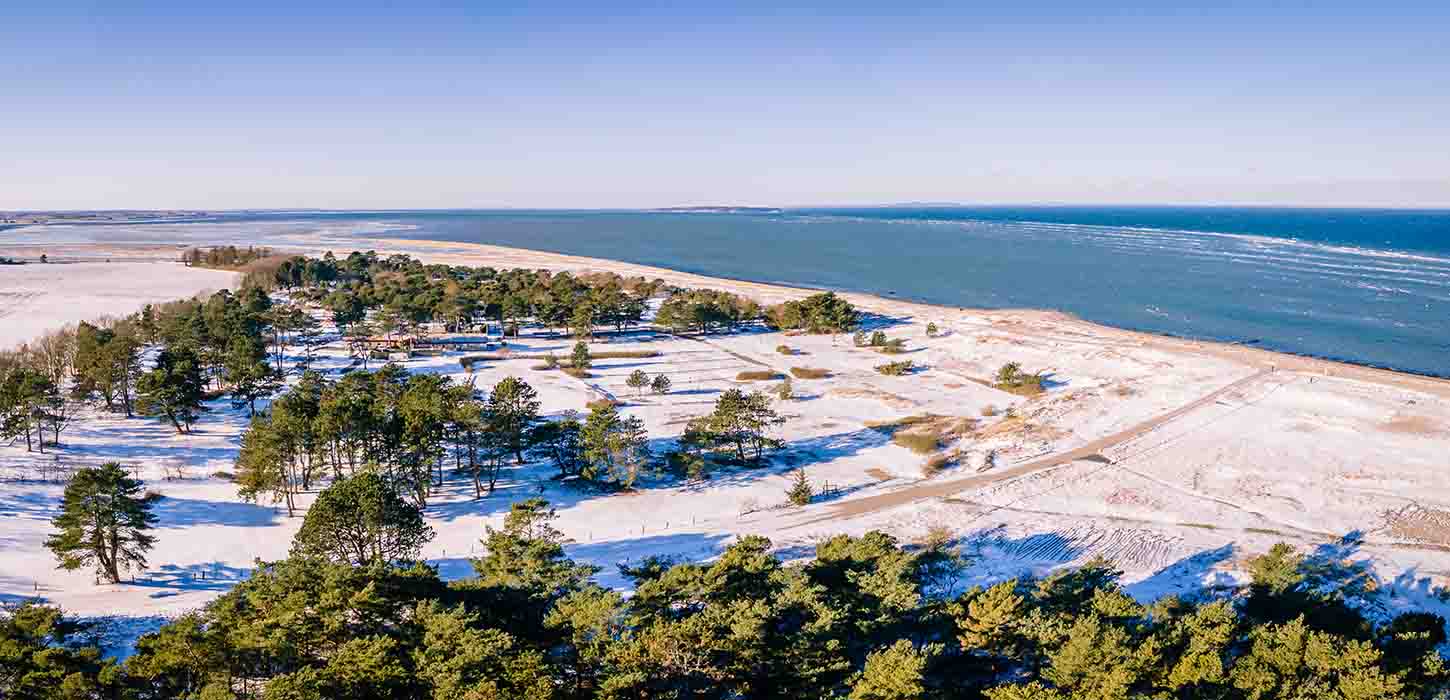 Flyvesandet wit a bit of snow in wintertime seen from the air
