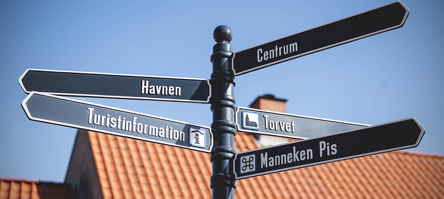 Signs in the street show the way to Bogense's attractions