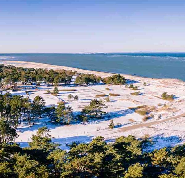 Flyvesandet wit a bit of snow in wintertime seen from the air