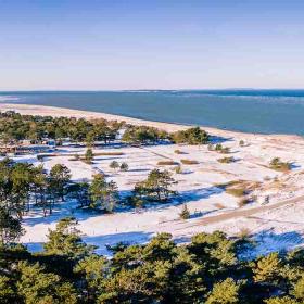 Flyvesandet wit a bit of snow in wintertime seen from the air